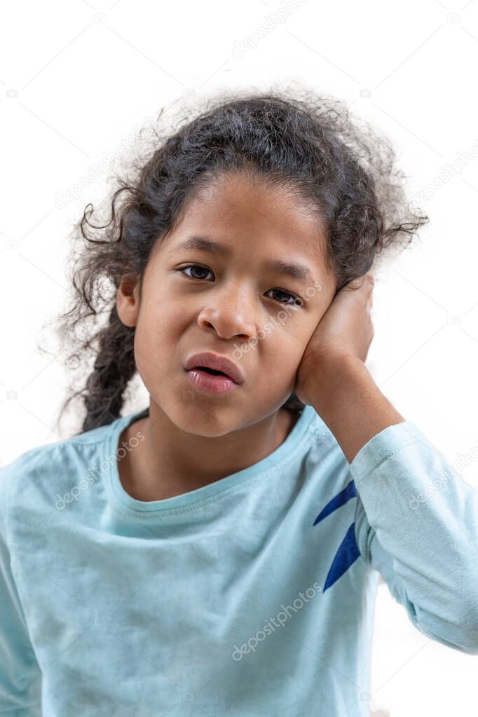 The Ear ache. Teen girl on a blue background. Facial expressions and people emotions concept. Beautiful, looking.on White