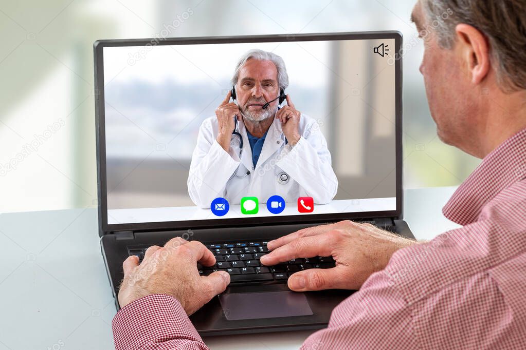 Telemedicine: hand of a man using computer with calling icon in here,phone ,song,camera,and messaging,and live chat ith doctor on screen on white