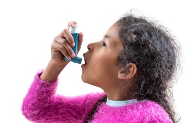Close-up portrait of cute 5 year old girl using his asthma inhaler, profile view white background clipart