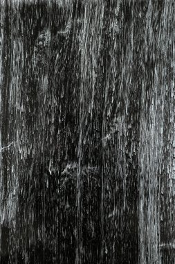 Tahtadaki boyanmış dokunun siyah ve beyaz arka planı.