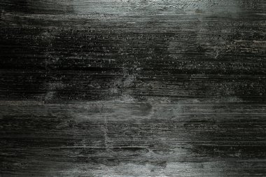 Tahtadaki boyanmış dokunun siyah ve beyaz arka planı.