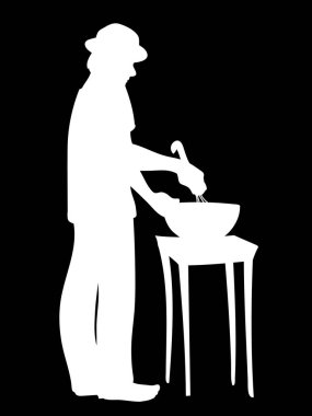 Şapkalı adam yemek hazırlar. Adam ayakta duruyor, malzemeleri kasede karıştırıyor. Beyaz insan siluetinin vektör çizimi siyah arka planda izole edilmiş kurabiyeler pişirir. Stencil. Kavram.