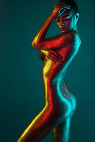 Sexy Girl Gold Plated Glittering Posing Neon Light — Stock Photo, Image