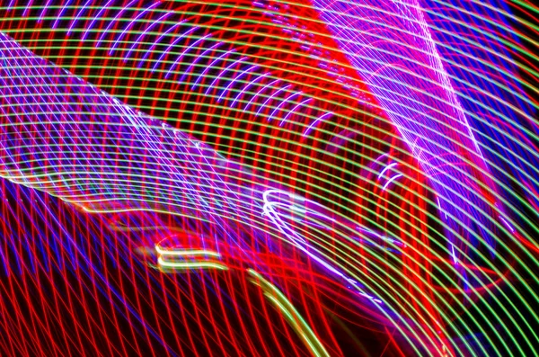 Light effects with blurred magic neon light curved lines