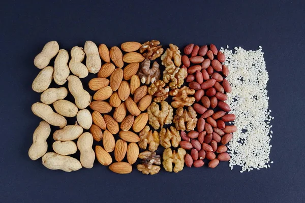 Assorted mixed nuts, peanuts, almonds, walnuts and sesame seeds.