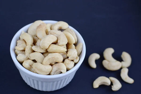 White bowl of cashew nuts