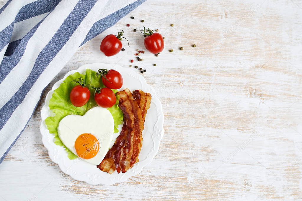 Tasty Fried Egg in the Shape of a Heart Served on a White Plate Bacon Pepper Tomato Salad Leaves Wooden Background Valentine Day Morning