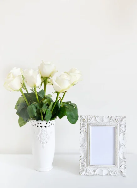 White vase with rose and photo frame vintage style, white background