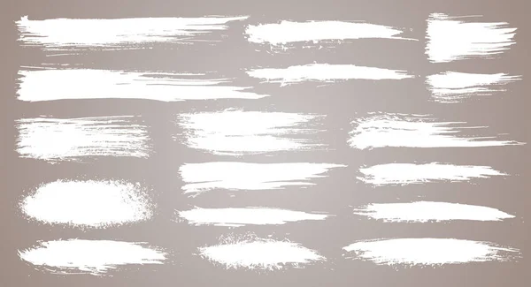 Artistik fırça darbeleri, fırça darbeleri. Yaratıcı tasarım elementleri. Grunge suluboya fırça darbeleri. Beyaz arkaplanda beyaz koleksiyon izole edildi