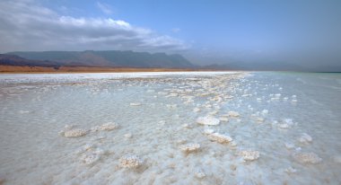 LAKE ASSAL,DJIBOUTI-FEBRUARY 06,2013:The saltiest lake in the world. The lowest point of Africa clipart