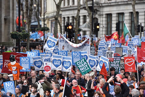 London, UK - March 4, 2017: Protesters marching through central London during demonstration in support of NHS