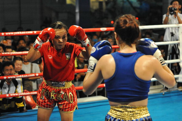 BANGKOK, THAILAND - January 23, 2013: Unidentified fighters competiting in amateur Thai Kickboxing, or Muay Thai.