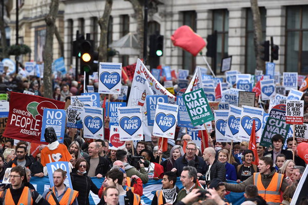 London, UK - March 4, 2017: Protesters marching through central London during demonstration in support of NHS