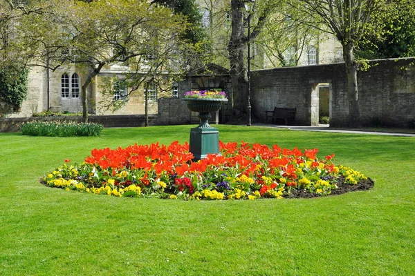 Decorated flowerbed in center of green garden — Stock Image Decorated Flowerbed Center Green Garden Royalty Free Stock Photos