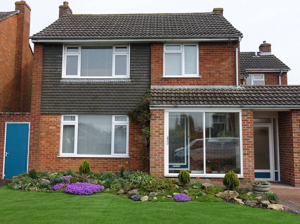 View of Garden and Red Brick House on London Residential Estate