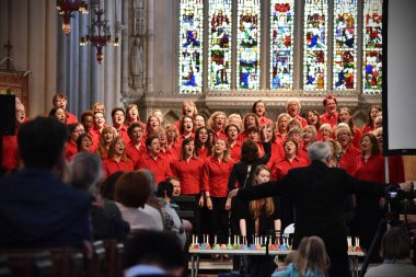 Bath, UK - May 19, 2017: A choir performs at a service at Bath Abbey. clipart