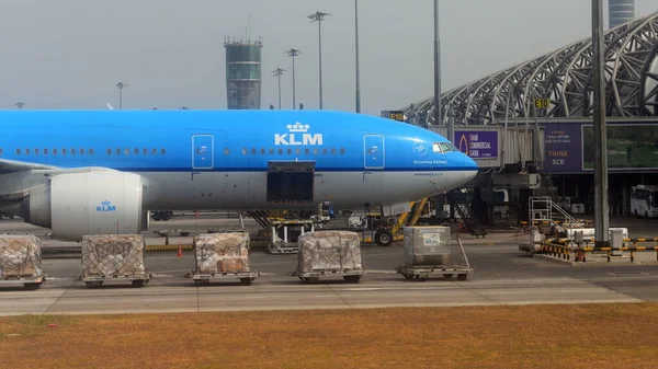 stock image airport terminal with blue airplane 