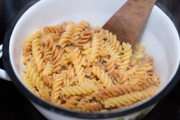 Italian fusilli pasta homemade cooked boiled in a saucepan — Stock Photo, Image