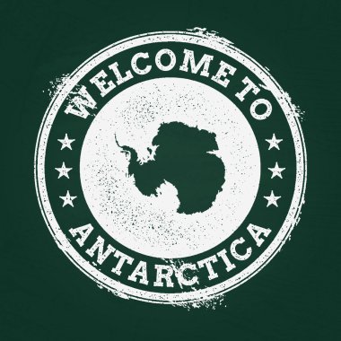 Beyaz tebeşir doku retro damga ile Antarktika harita üzerinde yeşil bir yazı tahtası.