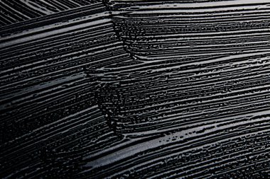 Beyaz sabun doku el yapımı hipster köpük doku soyut siyah arka plan üzerine beyaz atlı beyaz köpük