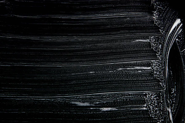 Textura de jabón blanco Espuma blanca extraordinaria sobre fondo negro Textura de espuma hipster hecha a mano — Foto de Stock