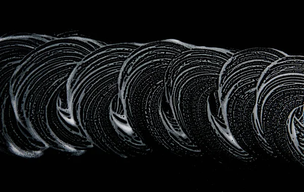 Beyaz sabun doku siyah arka planda el yapımı hipster köpük doku soyut büyük beyaz köpük