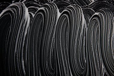 Beyaz sabun doku güzel beyaz köpük üzerinde siyah arka plan el yapımı hipster köpük doku soyut