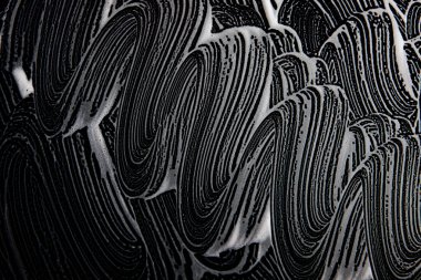 Beyaz sabun doku güzel beyaz köpük üzerinde siyah arka plan el yapımı hipster köpük doku soyut