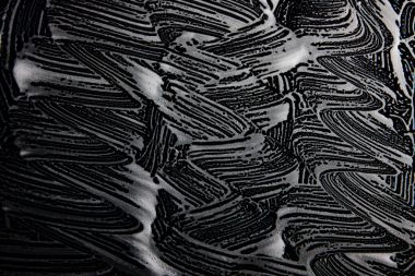 Beyaz sabun doku siyah arka planda el yapımı hipster köpük doku soyut ışık saçan beyaz köpük