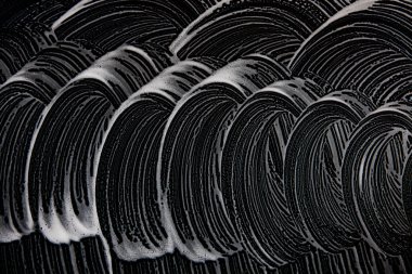 Beyaz sabun doku Yüce beyaz köpük üzerinde siyah arka plan el yapımı hipster köpük doku soyut