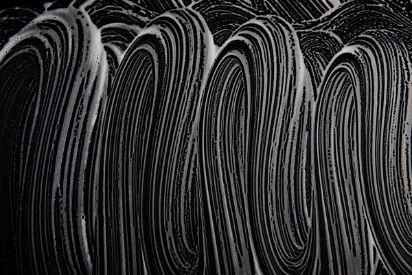 Beyaz sabun doku güzel beyaz köpük üzerinde siyah arka plan el yapımı hipster köpük doku soyut