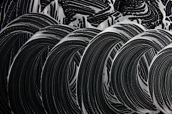 Beyaz sabun doku düzgün beyaz köpük üzerinde siyah arka plan el yapımı hipster köpük doku soyut