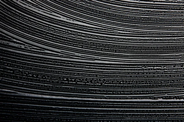 Textura de jabón blanco Cautivante espuma blanca sobre fondo negro Textura de espuma hipster hecha a mano — Foto de Stock