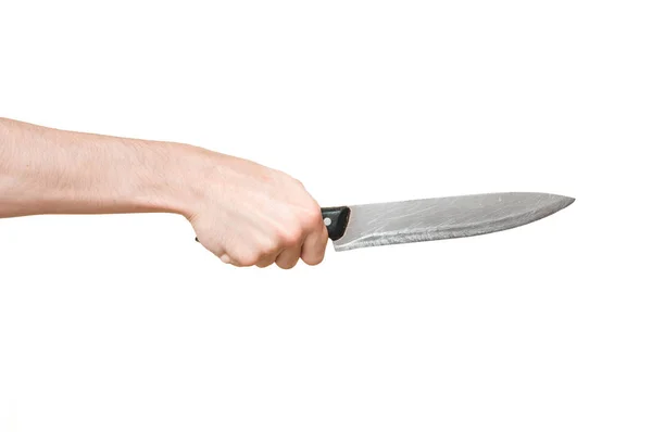 Mano masculina sosteniendo un cuchillo de cocina grande y afilado en posición amenazante sobre amplio fondo blanco . —  Fotos de Stock