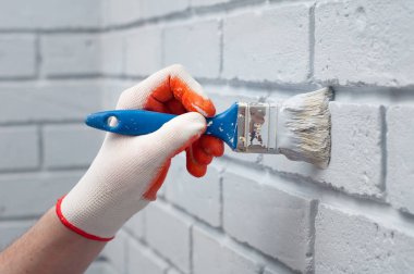 Soyut gri geniş bile doğrusal model resim eldiven erkek kol dokulu beton tuğla duvar arka plan.