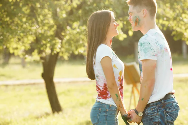 Handsome man and beautiful woman shawing their painted colorful — Stock Photo, Image