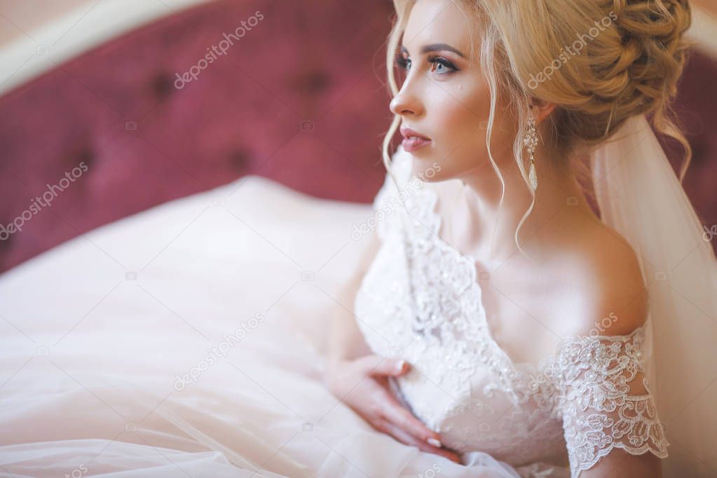 Tender bride in elegant lace wedding dress