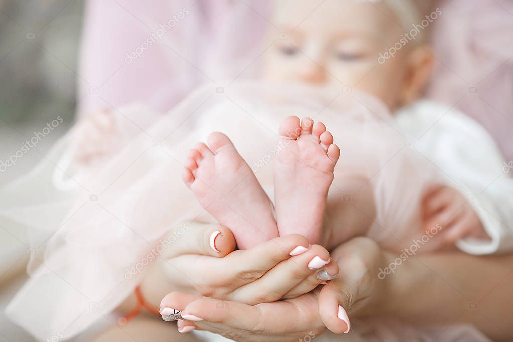 Little baby`s toes and feet in front. Close up still of child`s feet. Baby care  concept.