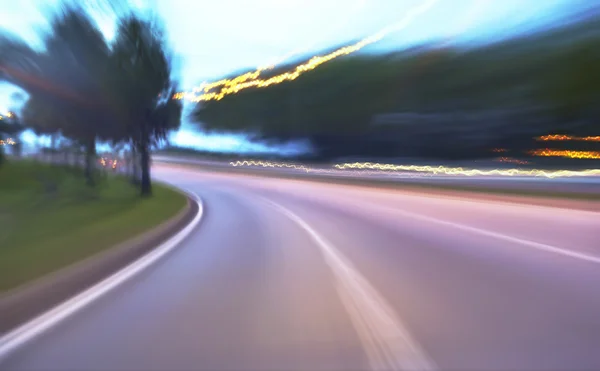 Evening road with blurred lights — Stock Photo, Image