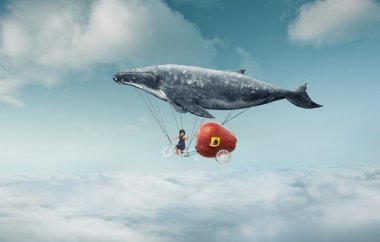 whale with apple and two girls over clouds
