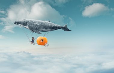whale with pumpkin and two girls over clouds
