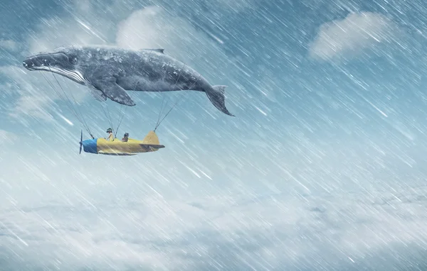 Whale with aircraft and two girls over clouds — Stok fotoğraf