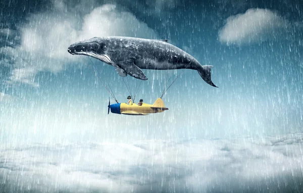 Whale with aircraft and two girls over clouds — 스톡 사진