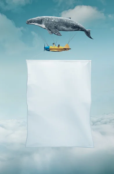 Baleia com avião e duas meninas sobre bandeira — Fotografia de Stock