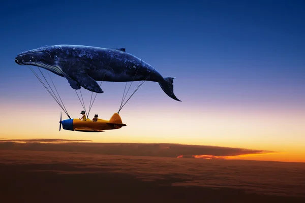 Whale with aircraft and two girls over clouds — Stock Photo, Image