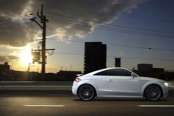 White car driving fast — Stock Photo, Image