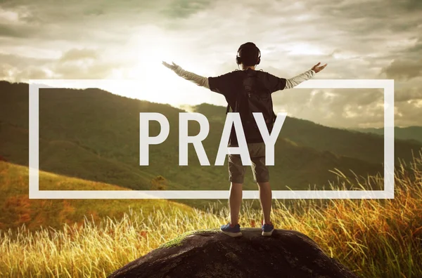 Pray concept with man in mountains — Stock Photo, Image