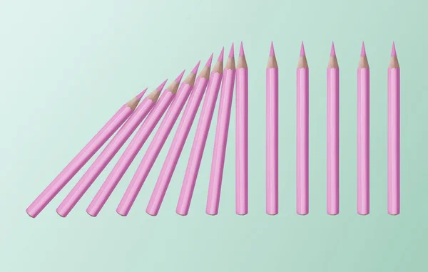 Эффект домино розовых карандашей — стоковое фото
