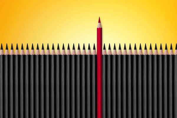 Crayon rouge se détachant du noir — Photo