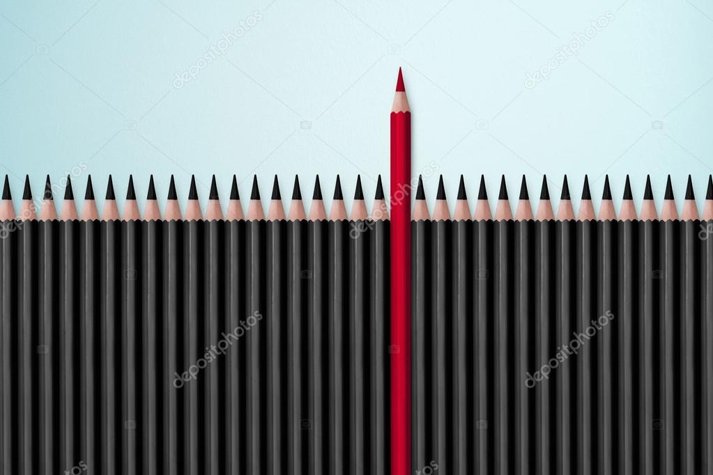 Red pencil standing out from black